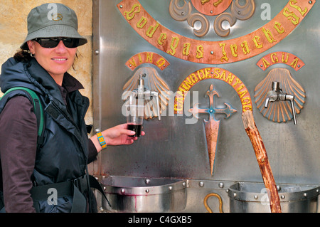 Spain, St. James Way: Pilgrim at the Wine fountain of Bodegas de Irache Stock Photo