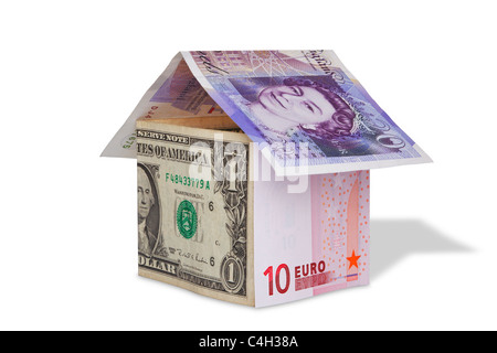 Photo of a house made from British Pound, US dollar and Euro banknotes, isolated on white with clipping path.