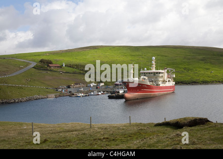 Shetland Isles Scotland Altaire fishing vessel moored in sheltered Collafirth harbour an inlet off Yell Sound on Shetland mainland Stock Photo