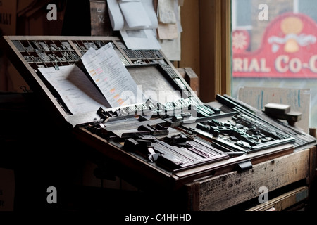 Old fashioned compositors table with metal letters at the printshop in Beamish museum Durham England Stock Photo