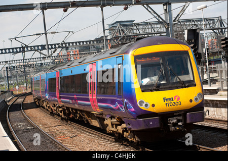 Class 170 turbostar train in First Transpennine Express livery arriving at a railway station in England. Stock Photo