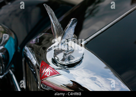 A crafted hood mascot ornament of old classic Alvis Silver Eagle car
