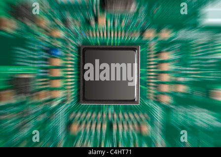 Closeup of computer chip with zoom effect on green board Stock Photo