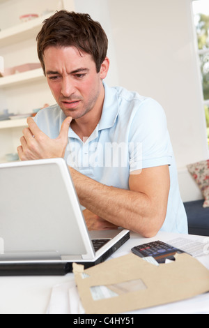 Young man working with laptop computer Stock Photo