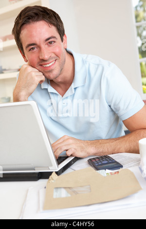Young man working with laptop computer Stock Photo