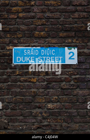 Official street sign for Duke St. on redbrick wall in Dublin city ...