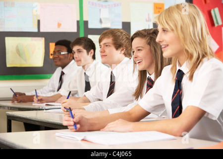 Teenage Students Studying In Classroom Stock Photo