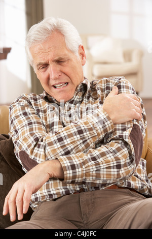 Senior Man Suffering Cardiac Arrest At Home Stock Photo