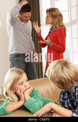 Parents Having Argument At Home In Front Of Children Stock Photo