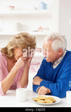 Senior Man Consoling Wife Stock Photo