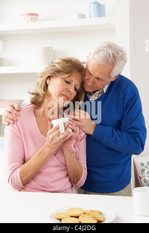 Senior Man Consoling Wife Stock Photo