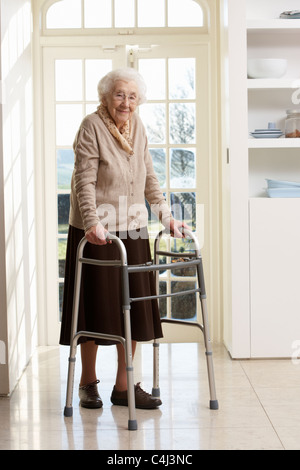 Elderly Senior Woman Using Walking Frame Stock Photo