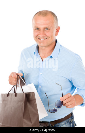 Elegant modern mature man hold shopping bags and present Stock Photo