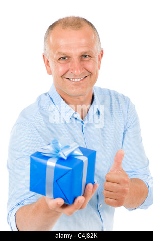 Elegant modern mature man hold bleu present thumb up Stock Photo