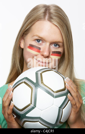 Young Female Sports Fan With German Flag Painted On Face Stock Photo