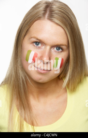 Young Female Sports Fan With Italian Flag Painted On Face Stock Photo