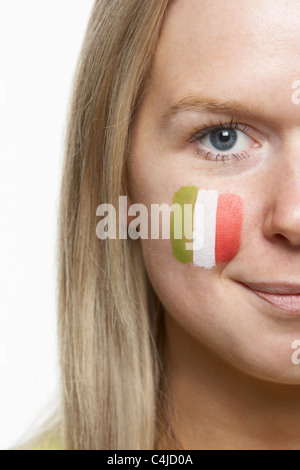 Young Female Sports Fan With Italian Flag Painted On Face Stock Photo