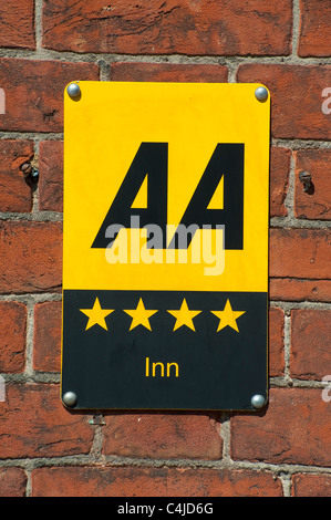 AA sign on the side of an inn showing it has a four star rating. Stock Photo