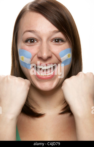 Young Female Sports Fan With Argentinian Flag Painted On Face Stock Photo