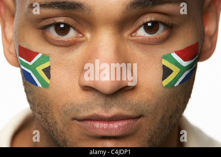 Disappointed Young Male Sports Fan With South African Flag Painted On Face Stock Photo