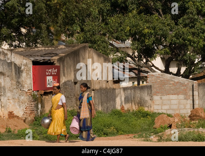 Women on their way to fetch water outside Bangalore Stock Photo