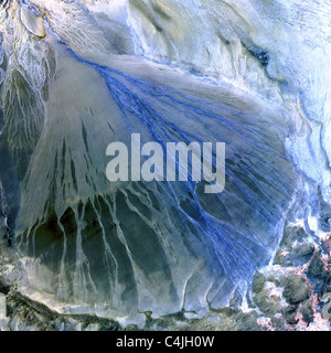 An alluvial fan between the Kunlun and Altun mountain ranges that form the southern border of the Taklimakan Desert in China. Stock Photo