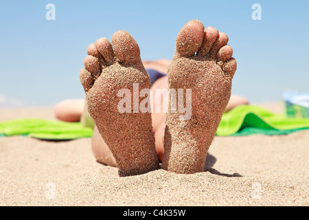 Bottom Of Male Feet Covered With Sand On The Beach In Sunshine Stock bottom-of-male-feet-covered-with-sand-on-the-beach-in-sunshine-stock