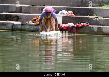 Woman washing clothes, Dutch or Mattancherry Palace, Fort Cochin Kerala, India Stock Photo