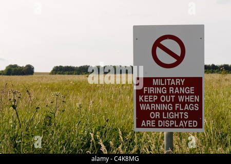 Sign 'Military firing range.  Keep out when warning flags or lights are displayed' Stock Photo
