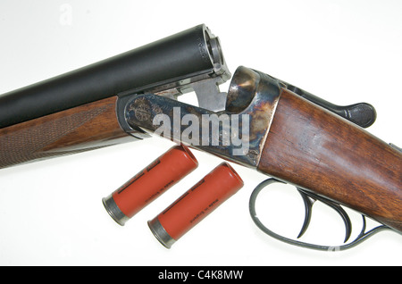 A 12 gauge bore shotgun. This is an AYA No 4 Boxlock side-by-side double barreled gun 'broken' to insert cartridges. Stock Photo