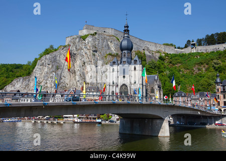 Pont du Charles de Gaulle bridge over the Meuse river, colorful saxophones as a memorial to Adolphe Sax, Church of Notre-Dame an Stock Photo