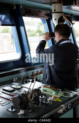 Navigation Officer. Passenger ship "Clipper Odyssey" on watch on the Bridge of the ship. Montrose Scotland UK Stock Photo