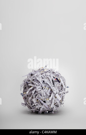 A ball of shredded paper on a light grey background Stock Photo
