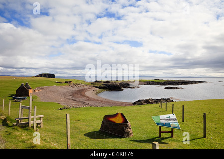 Stenness, Eshaness, Shetland Islands, Scotland, UK. Tourist information at old Haaf station with fishing lodges around bay Stock Photo