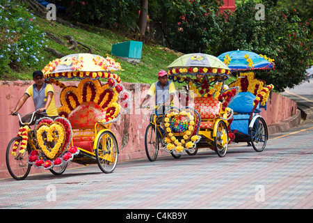 Three Colourful Rickshaw in Melaka, Malaysia Stock Photo