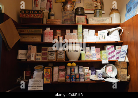 Shelves full of food and provisions in a Victorian grocers shop Stock Photo