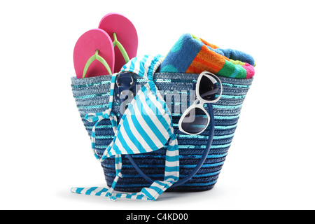 Beach bag with swimming suit,isolated on white background. Stock Photo