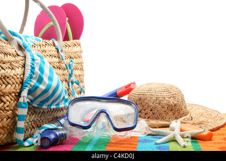 beach bag with swimming suit and diving equipment.Isolated on white background. Stock Photo
