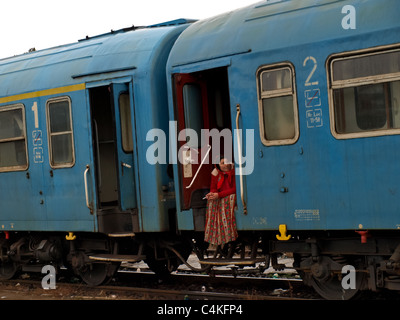 Gipsy woman in an old train, Romania, Sibiu Rail Station. Stock Photo