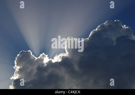 Sun shining through the clouds Stock Photo