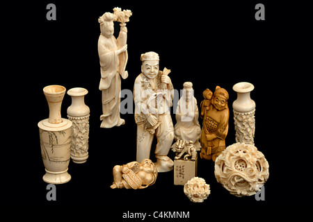 A group of japanese chinese ivory carvings okimono Stock Photo