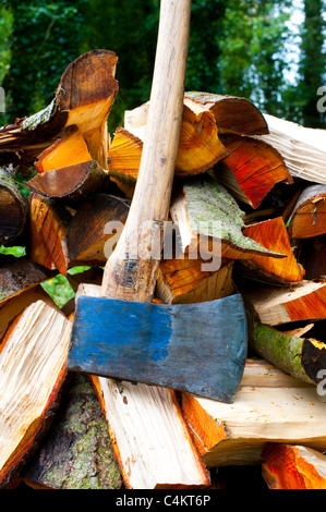 Axe and split logs Stock Photo