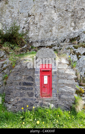 RED LETTER BOX, this example is cast in stone, literally,  and was a product of the Victorian era postal service. Stock Photo