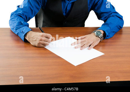 Close up of the body of a professional man sitting with his hands on a desk. Stock Photo