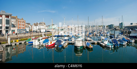 A 2 picture stitch of boats and yachts moored at the southern end of Sutton Marina harbour in Plymouth. Stock Photo