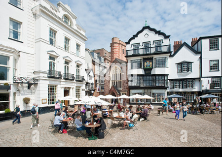 The junction of Cathedral Yard (left) and Cathedral Close (right) where there are many cafes, bars and restaurants in Exeter. Stock Photo