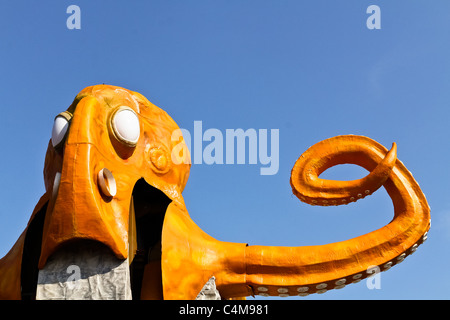 An orange octopus ride without passengers in an amusement park Stock Photo