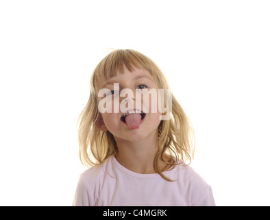 little girl puts out her tongue Stock Photo