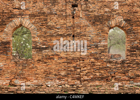 ancient brick wall and windows at Wat Phra Ram khmer temple in ayutthaya, thailand Stock Photo