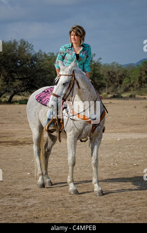 Horseback riding cowgirl Stock Photo